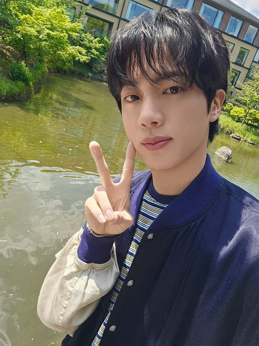 BTS Jin wore a BY (Stripe T-shirt Multi).